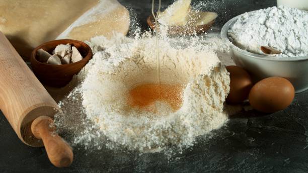 istock Freeze motion of falling raw egg into flour 1249620637