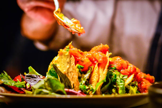 istock Mexican tacos with prawns, salad and salsa sauce 1249621491