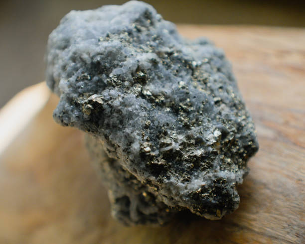 istock Pyrite in calcite mineral stone 1249623073