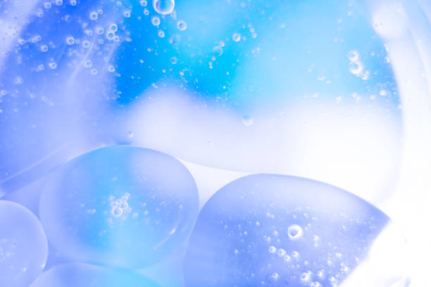 istock bubble oil drops on the water surface, abstract background 1249623167
