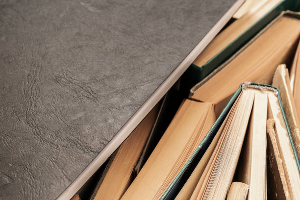 istock Black notebook lying on the side of books 1249630036