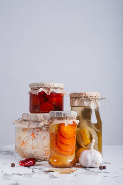 istock Fermented vegetables in jars on the table 1249630078