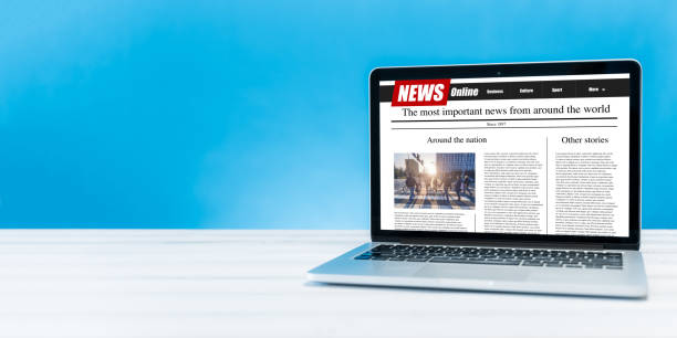 istock news on a computer screen. Mockup website. Newspaper and portal on internet 1249634115