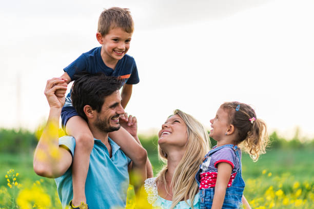 istock Young happy family enjoying nature 1249638545