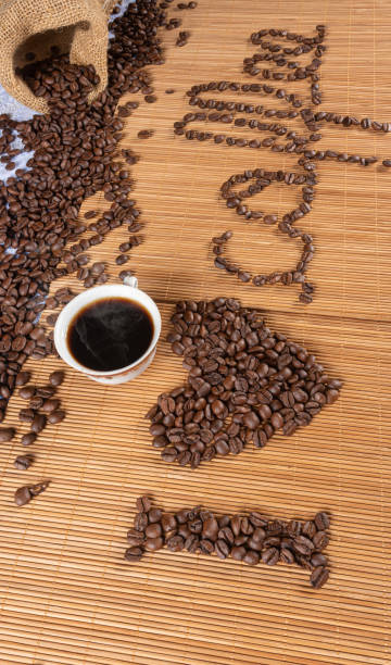 istock coffee beans forming drawings and phrases for those who love coffee. 1249639710