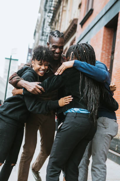 istock Group of Friends Hug in Urban Setting 1249641732