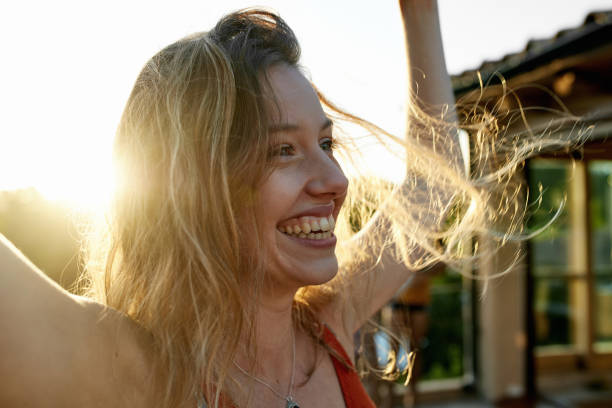 istock Relaxed Young Woman Celebrating Summer Freedom 1249641745