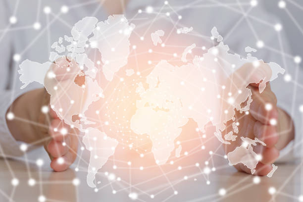 istock Globalization concept world map between the handprints of a girl. 1249643496