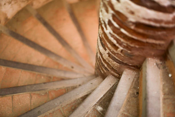 Shallow focus of a spiral staircase made of brick and wood