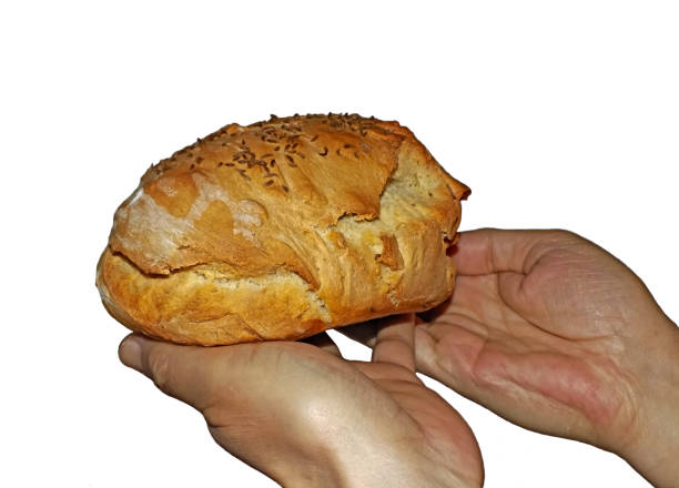 istock Person is holding just baked bread 1249646334