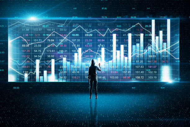 istock Hacker drawing glowing stock chart and investment data 1249646499