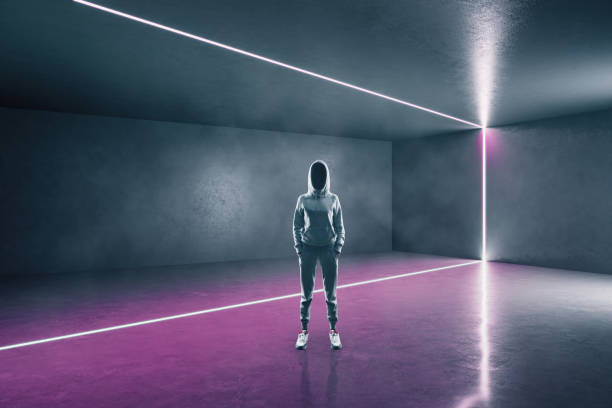 istock Hacker standing in futuristic gallery interior 1249648622