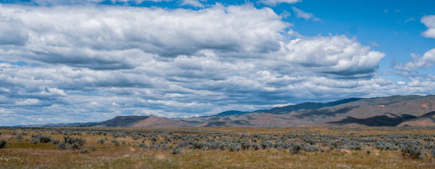 istock Summer high desert mountain landscape with blue sky and clouds 1249653703