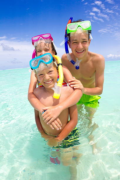 istock Children with snorkels in sea 124965673