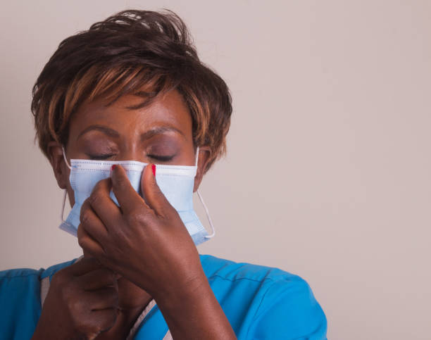 Man wearing medical face mask because of Coronavirus 2019-nCov pandemic