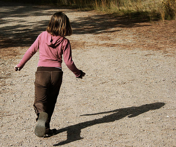 istock Little girl walks away beginning Journey 124966063