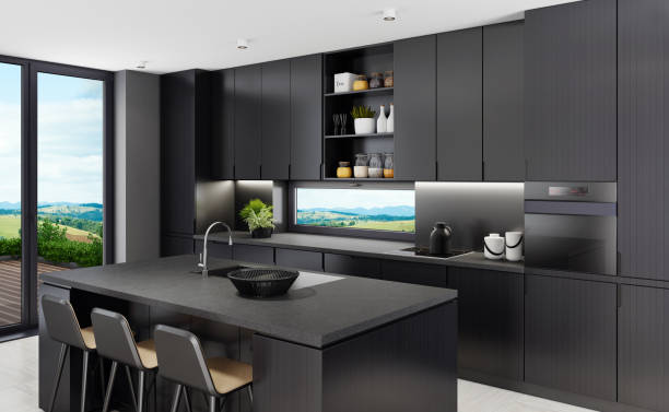 istock Luxurious matte black kitchen with island table at country side background 1249663257