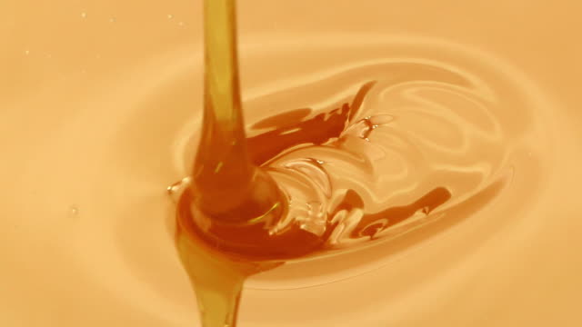 Close-up of honey falling