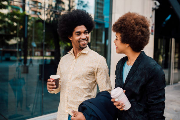 istock Young couple walking and talking 1249667447