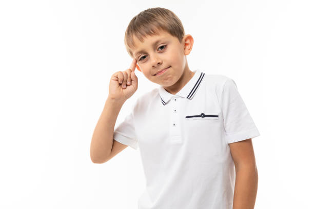 A little blonde boy think about it, picture isolated on white background