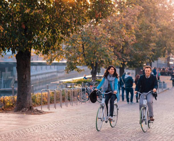 istock Couple Riding Bicycles In Autumn 1249667799