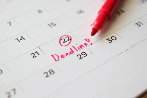 istock Deadline write on white calendar page date close up 1249670929