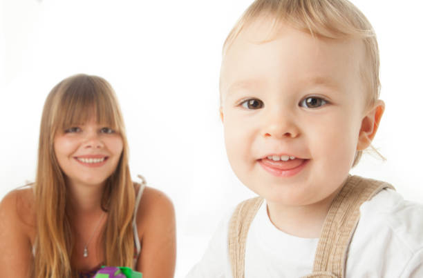 Au-pair enjoying special moment with little Australian boy, aged 18 months.