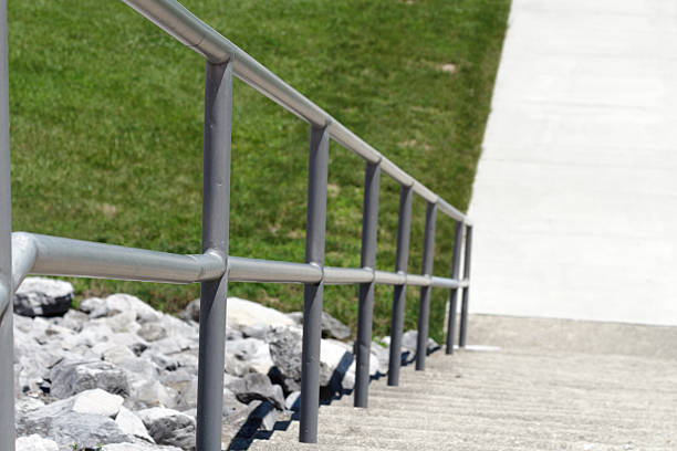Steep stairs with handrail stock photo