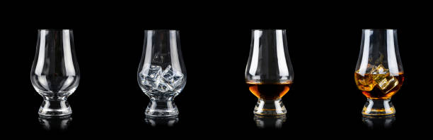 istock Set of four glasses for alcoholic drinks on black background 1249681681