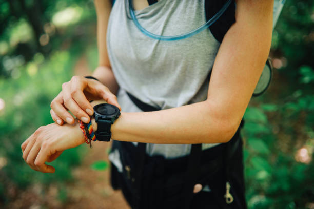 istock Woman hiker checking her smart watch 1249692047