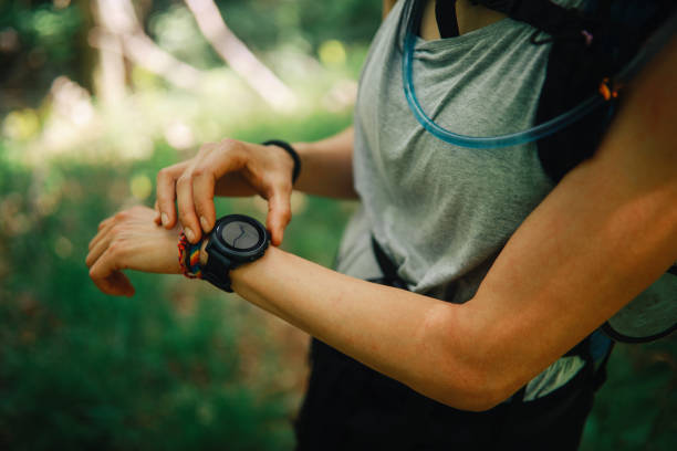 istock Woman hiker checking her smart watch 1249692910