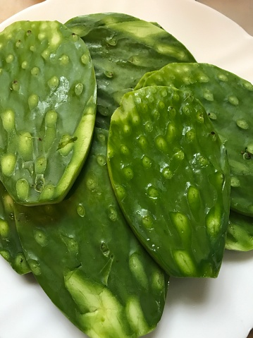 Photograph taken of some super fresh nopales. Nopal is an important part of Mexican cuisine and can be found in a large number of stews throughout Mexico.