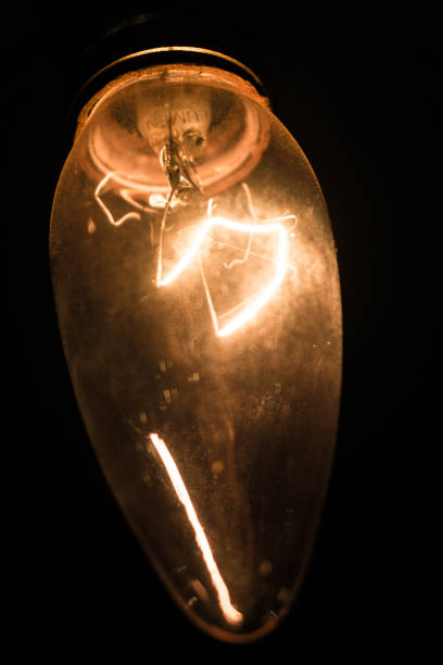 классический низкий свет прожектор, который светится тускло в темноте - lowlight стоковые фото и изображения