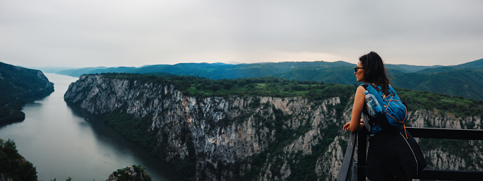 Woman overlooking the Iron Gates gorge on the river Danube.