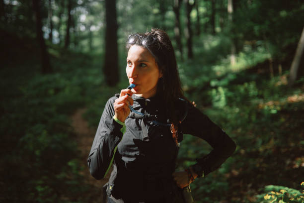 istock Woman hiking in the forest 1249698822