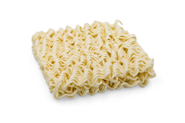 istock Uncooked instant noodle on white isolated background with clipping path. Instant noodles is unhealthy food or junk food have calorie and sodium from msg and but it convenience and cheap for quarantine 1249701393