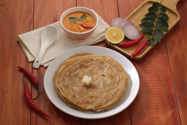 istock Malabar Wheat Porotta with wooden background 1249702303