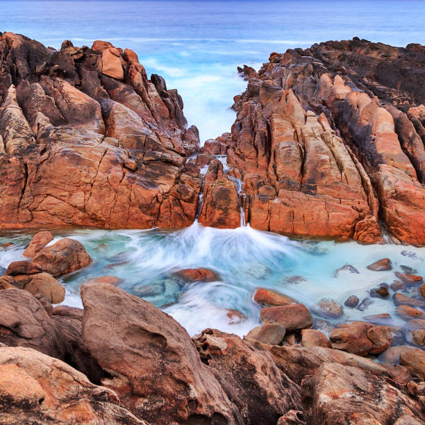 Injidup spa, a small pool fed by water from the ocean as it cascades over the rocks. At Wyadup Rocks near Yallingup in the Margaret River region of Western Australia.