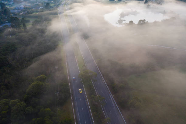 istock Early Morning Fog Over Highway 1249708487