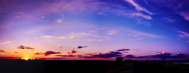 istock Bright sunlight through the clouds against a breathtaking evening sky at sunset. 1249713677