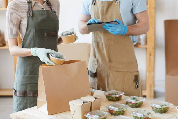 istock People packing food for delivery 1249716993