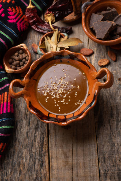 istock Mexican mole sauce on wooden background 1249717296