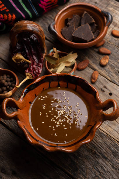 istock Mexican mole sauce on wooden background 1249718419