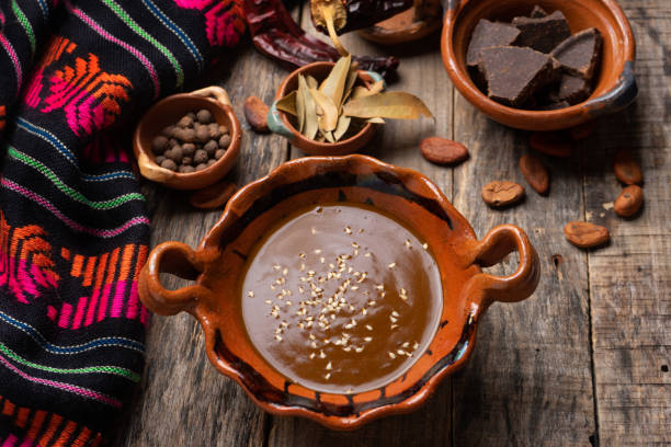 istock Mexican mole sauce on wooden background 1249718644
