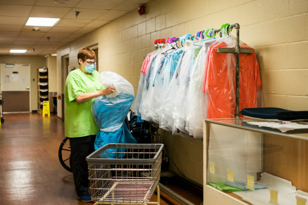 istock Laundering employee nursing scrub uniforms in a nursing facility 1249720598