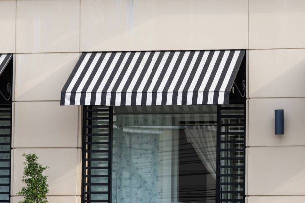 istock black and white awning over shop store window. 1249727276