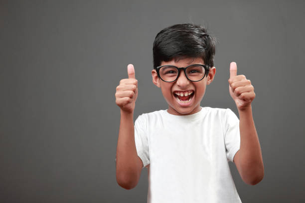 Portrait of a cheering little boy stock photo