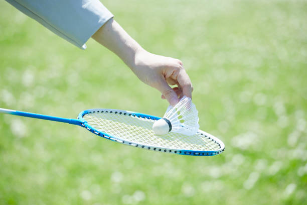 istock Young woman enjoying badminton on holidays 1249727634