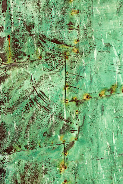 istock Beautiful abstract patterns and texture of rivted panels of exposed copper sheet with green aged patina 1249727754