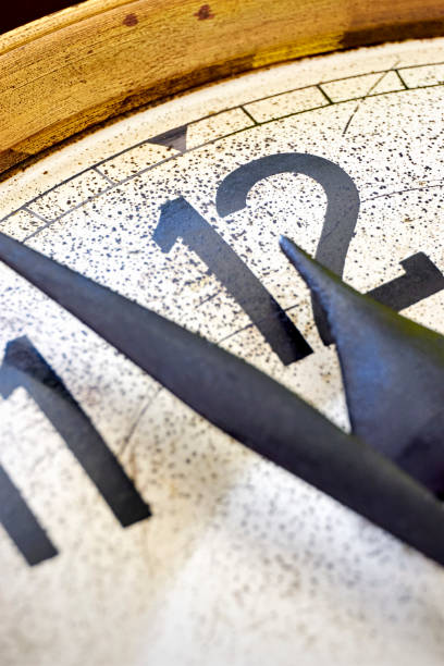 istock Old vintage clock shows 2 minutes to 12 o'clock 1249728077